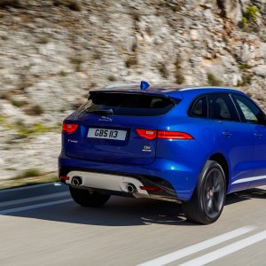 2017-Jaguar-F-Pace-First-Edition-rear-side-motion-view-and-mountain.jpg